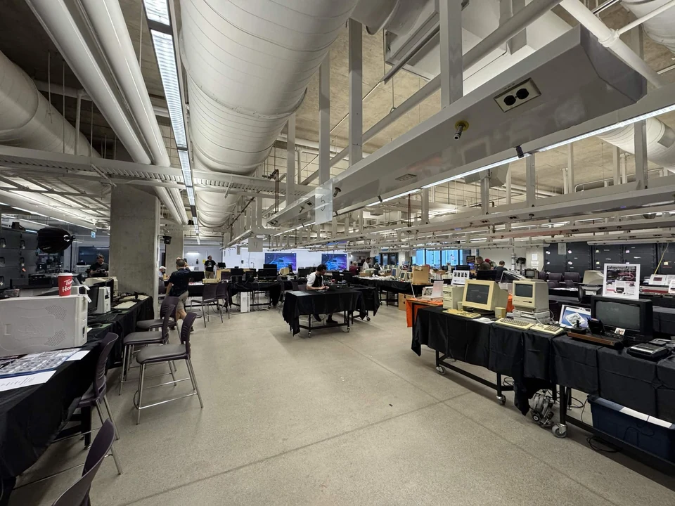 Exhibitor tables and vintage computers inside the WoRC Expo 2026 hall