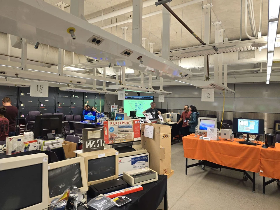 Vintage computers, software boxes and a presentation area at WoRC Expo 2026