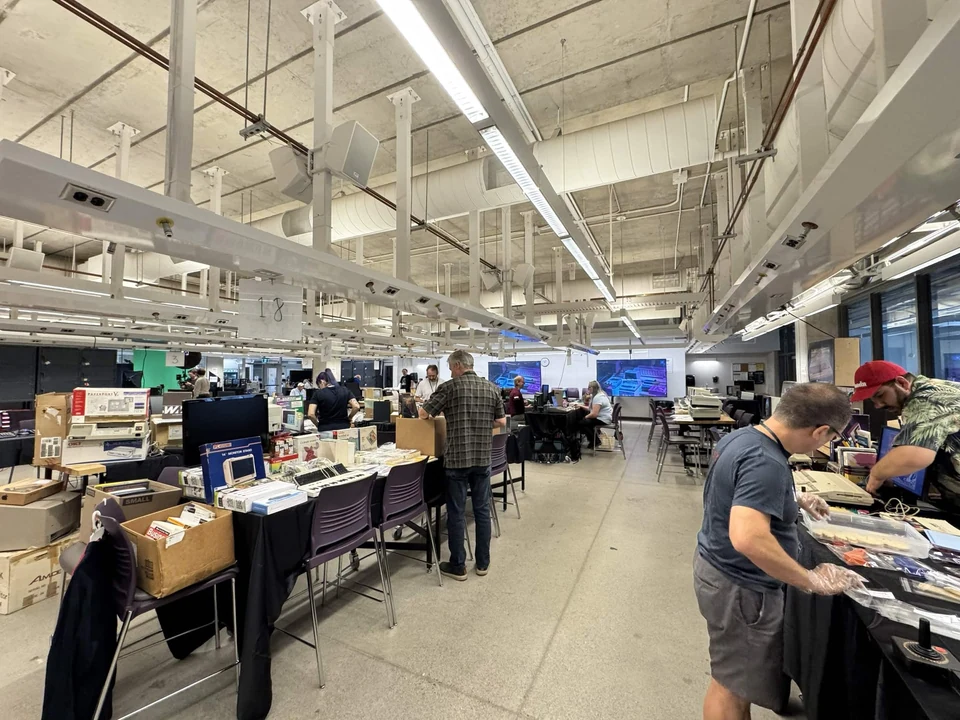 Visitors browsing retro-computing exhibitor tables at WoRC Expo 2026