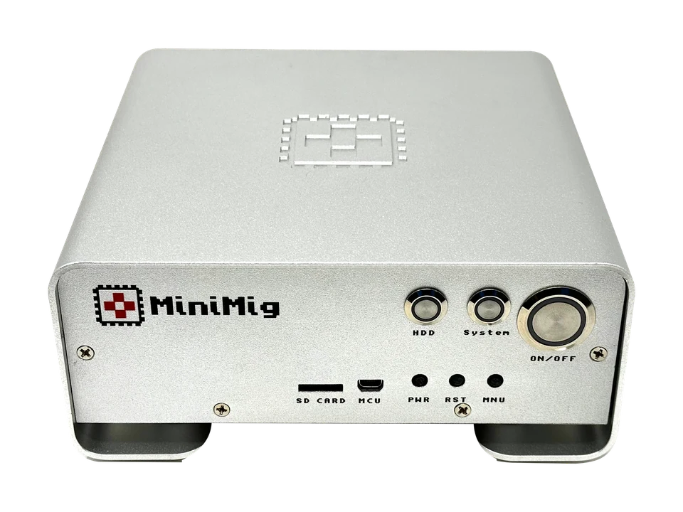 Minimig in its original metal case